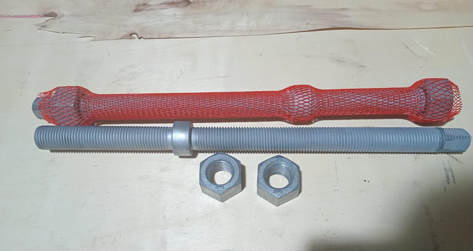 Hot-dip galvanised ASTM A193 B7M collar bolt with two ASTM A194 2HM heavy hex nuts