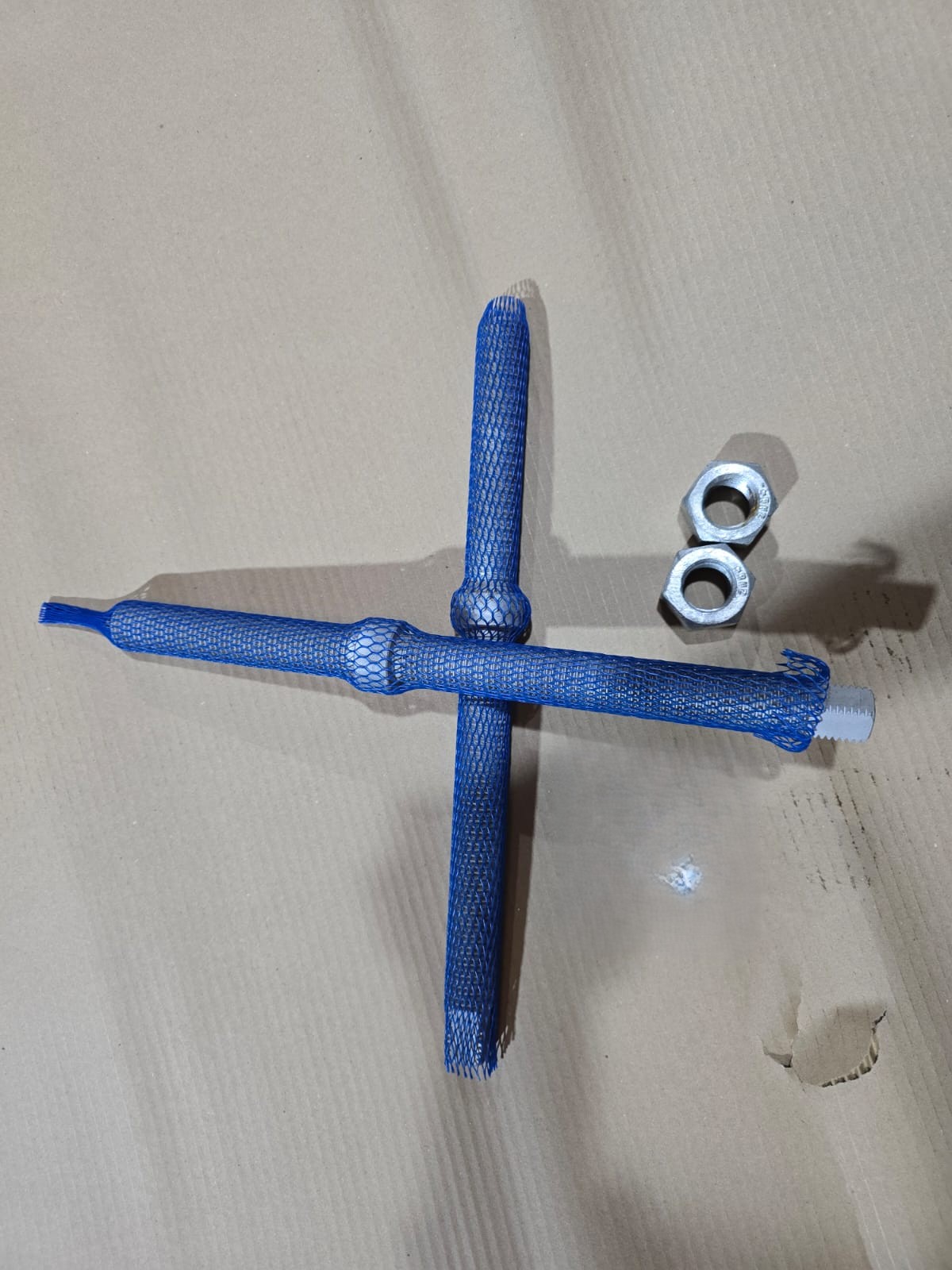 ASTM A193 B7M collar bolts in protective mesh sleeves with galvanised 2HM nuts