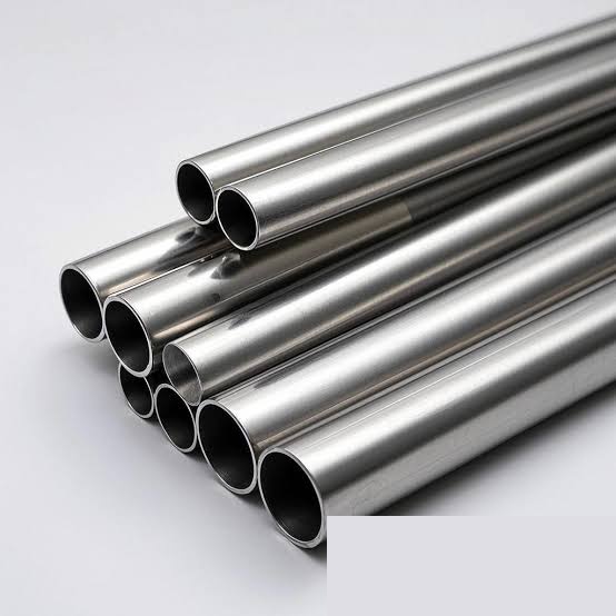 Polished nickel alloy pipes stacked for inspection