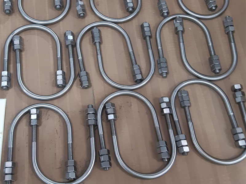 Super duplex U-bolts with matched nuts on a neutral background