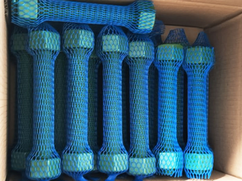 Xylan coated stud bolts and heavy hex nuts with visible thread detail